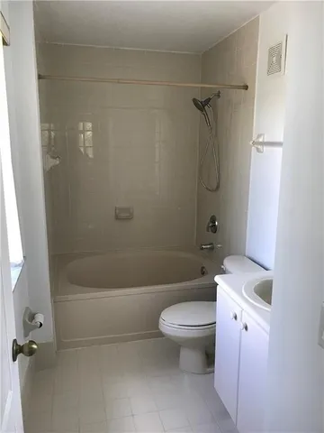 a bathroom with a sink a toilet and a bathtub