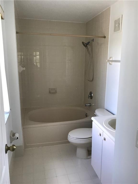 4331 Southwest 160th Avenue, Unit 200 Miramar, FL 33027 - Photo 15 of 19 a bathroom with a sink a toilet and a bathtub