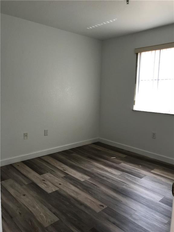 4331 Southwest 160th Avenue, Unit 200 Miramar, FL 33027 - Photo 16 of 19 wooden floor in an empty room
