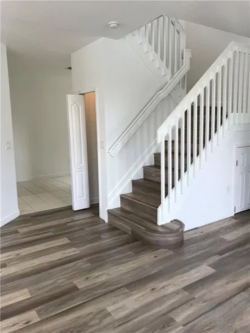 a view of entryway with wooden floor