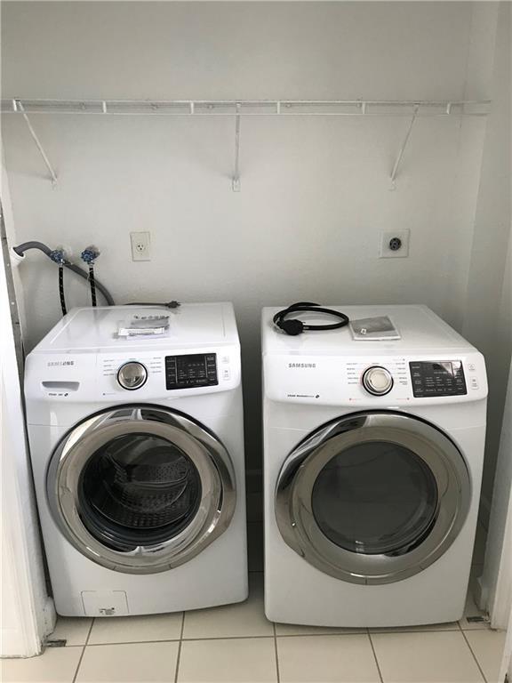 4331 Southwest 160th Avenue, Unit 200 Miramar, FL 33027 - Photo 6 of 19 a utility room with dryer and washer
