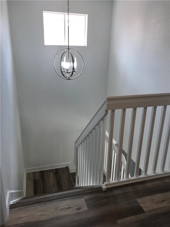 4331 Southwest 160th Avenue, Unit 200 Miramar, FL 33027 - Photo 10 of 19 a view of staircase with wooden floor