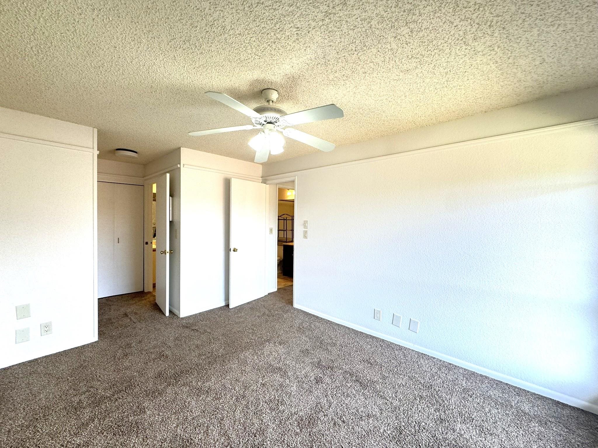 140 Uwapo Road, Unit 56204 Kihei, HI 96753 - Photo 11 of 40 an empty room with a empty space and a ceiling fan