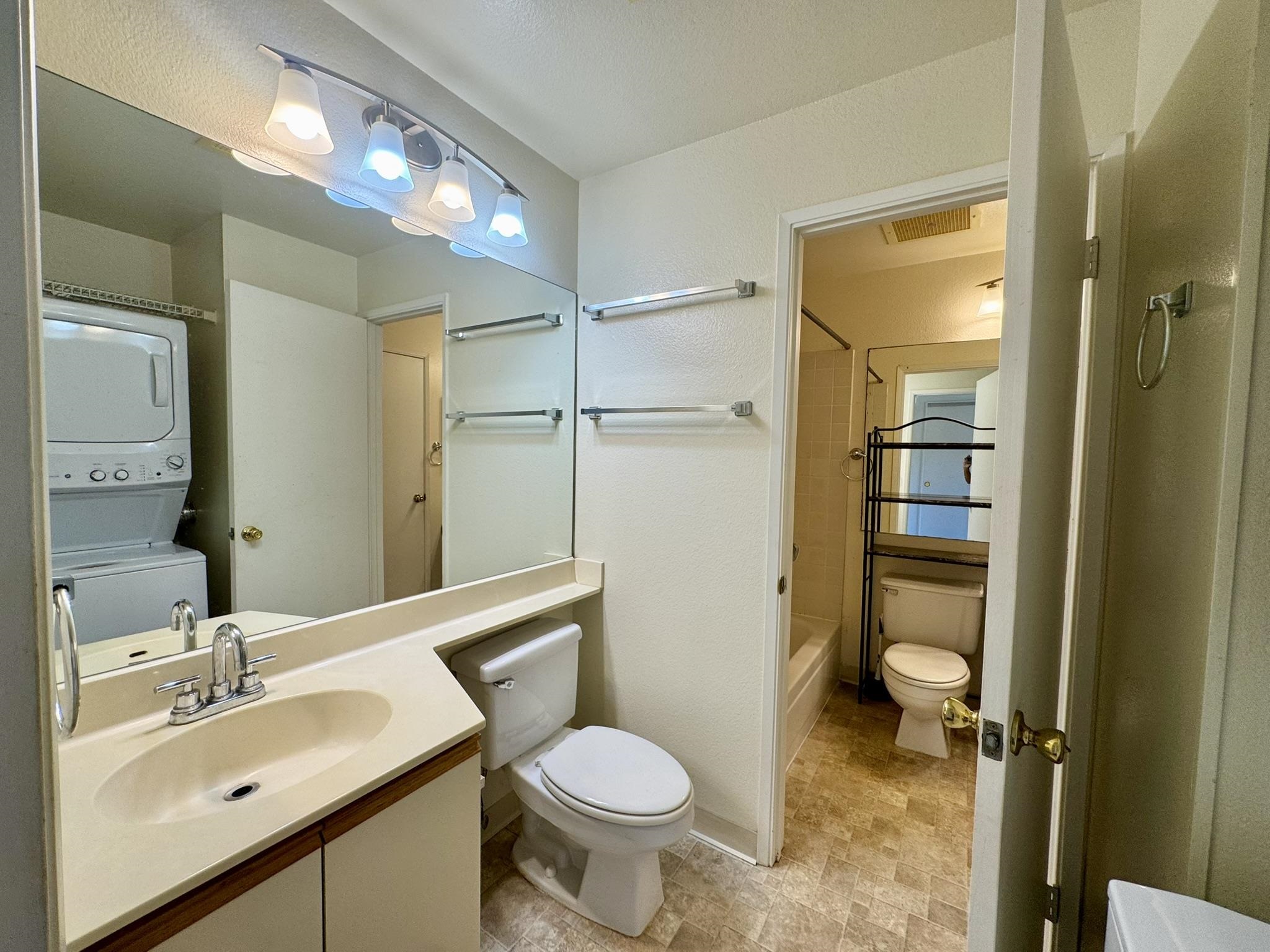 140 Uwapo Road, Unit 56204 Kihei, HI 96753 - Photo 15 of 40 a bathroom with a sink toilet tub and shower