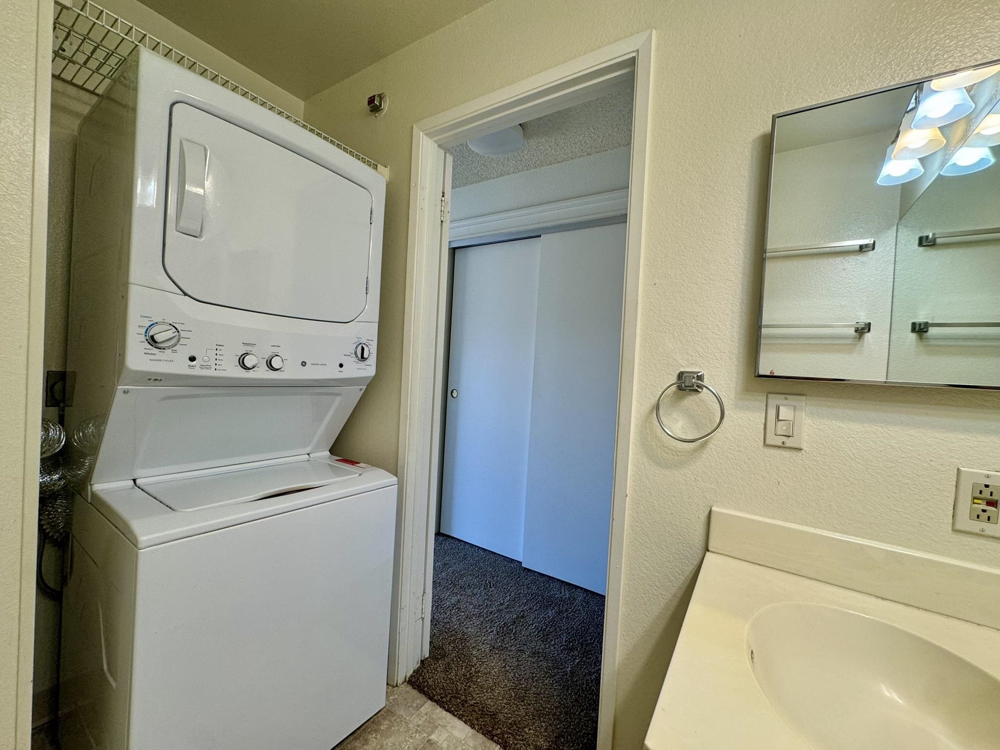 140 Uwapo Road, Unit 56204 Kihei, HI 96753 - Photo 17 of 40 a bathroom with a sink and a mirror