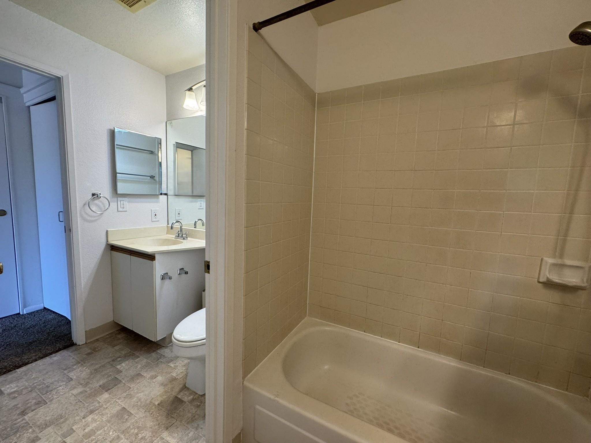 140 Uwapo Road, Unit 56204 Kihei, HI 96753 - Photo 19 of 40 a bathroom with a sink a toilet and shower