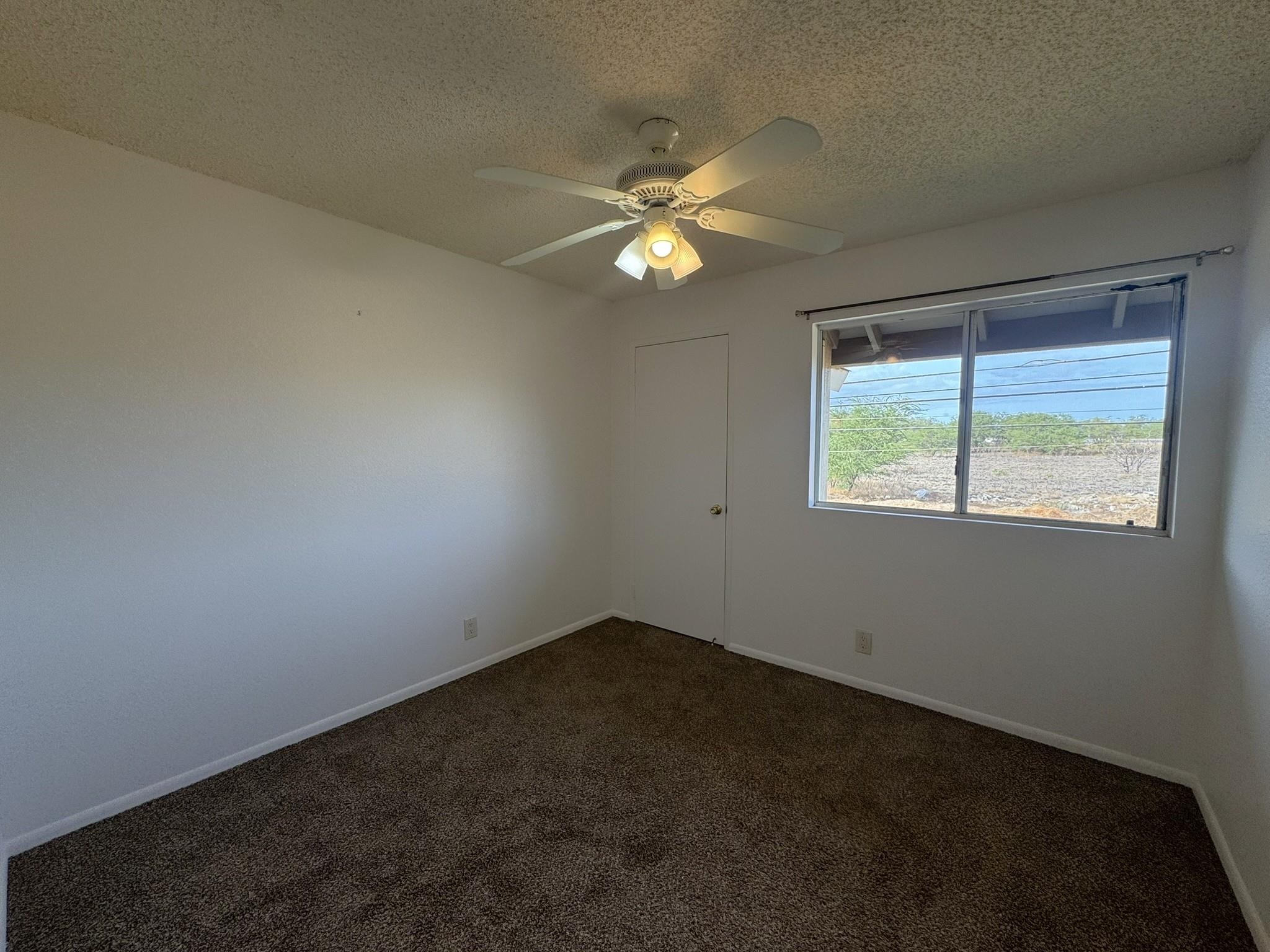 140 Uwapo Road, Unit 56204 Kihei, HI 96753 - Photo 20 of 40 an empty room with a window