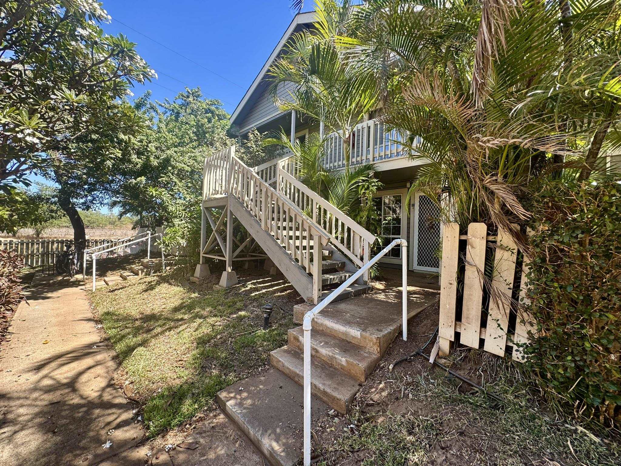 140 Uwapo Road, Unit 56204 Kihei, HI 96753 - Photo 30 of 40 a front view of a house with a yard