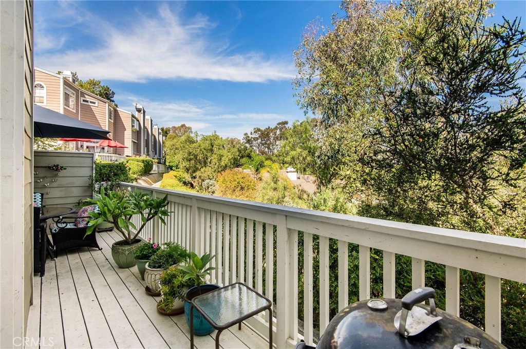 33072 Ocean Ridge Dana Point, CA 92629 - Photo 11 of 26 a view of a balcony with wooden floor and outdoor seating