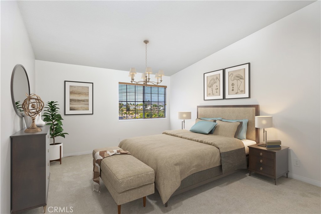 33072 Ocean Ridge Dana Point, CA 92629 - Photo 13 of 26 a bedroom with a bed and a chandelier