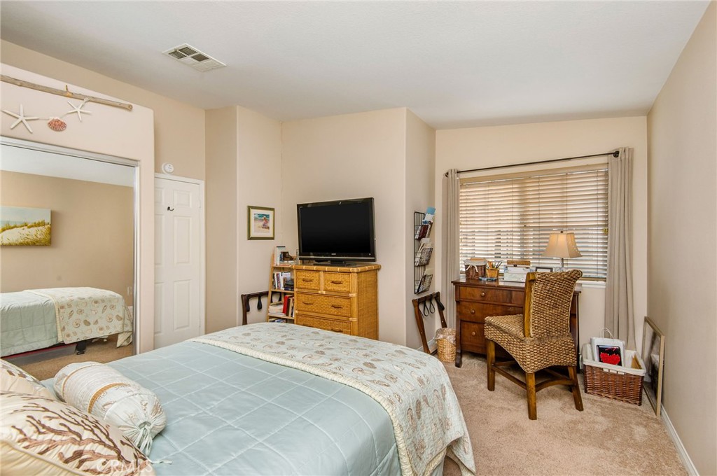 33072 Ocean Ridge Dana Point, CA 92629 - Photo 17 of 26 a bedroom with a bed and a flat tv screen