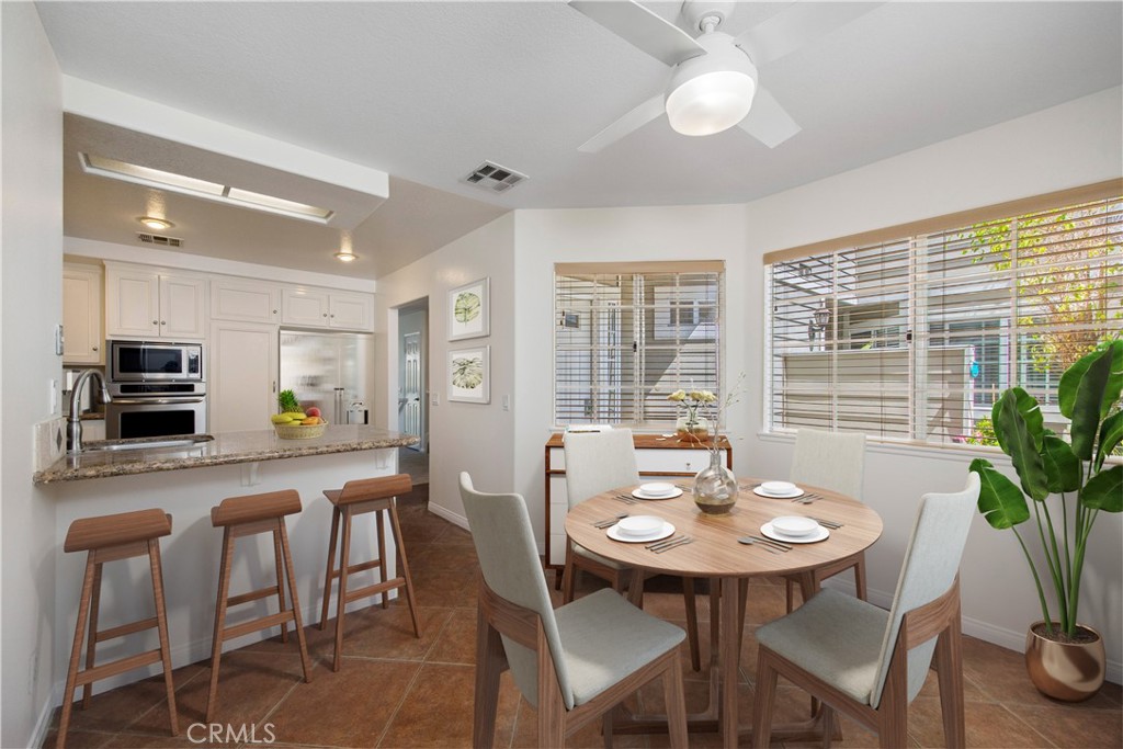 33072 Ocean Ridge Dana Point, CA 92629 - Photo 3 of 26 a view of a dining room with furniture and a potted plant
