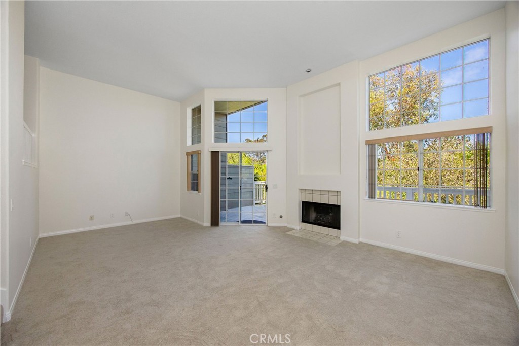 33072 Ocean Ridge Dana Point, CA 92629 - Photo 10 of 26 an empty room with furniture and a fireplace