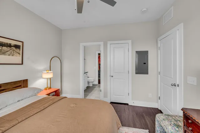 a bedroom with a bed and a dresser