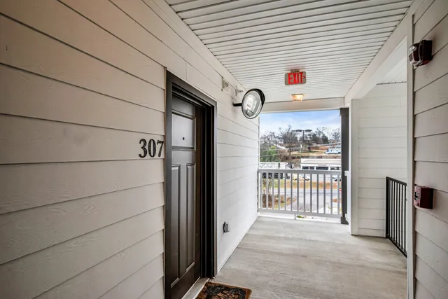 a view of a door and wooden floor