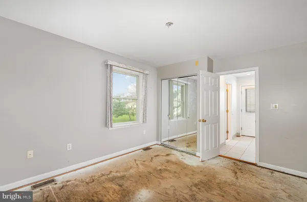 a view of an empty room and window