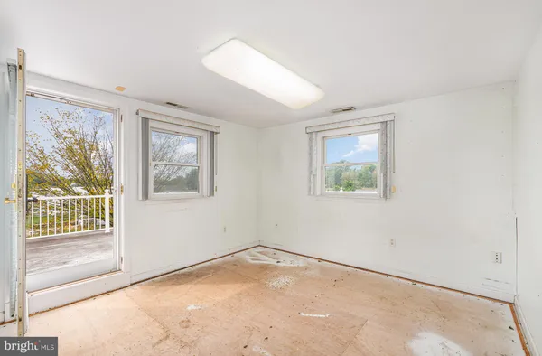 an empty room with windows