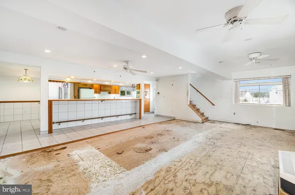 a view of a hallway with a living room