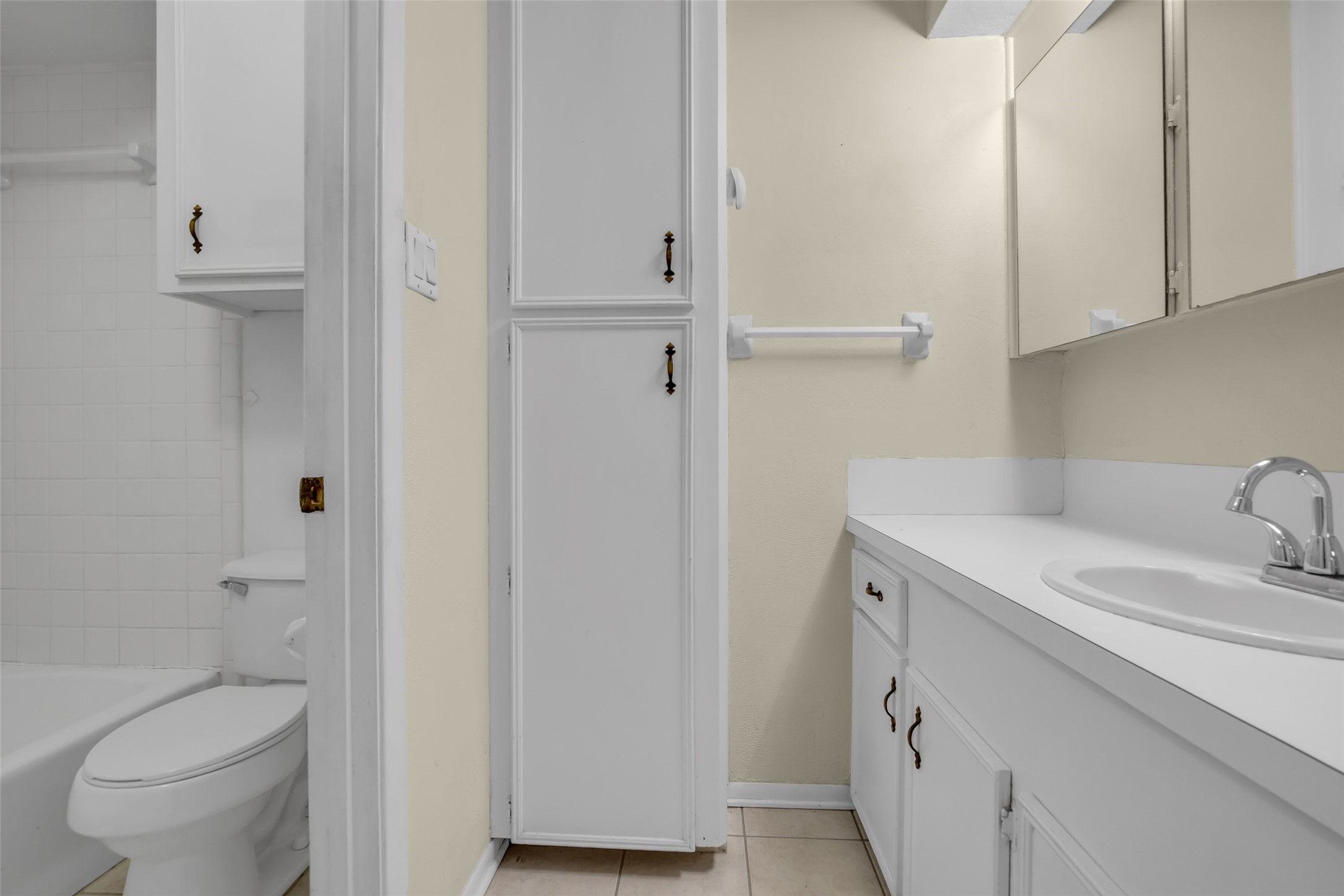 10002 Pinehurst Street Baytown, TX 77521 - Photo 11 of 17 a bathroom with a sink toilet and vanity