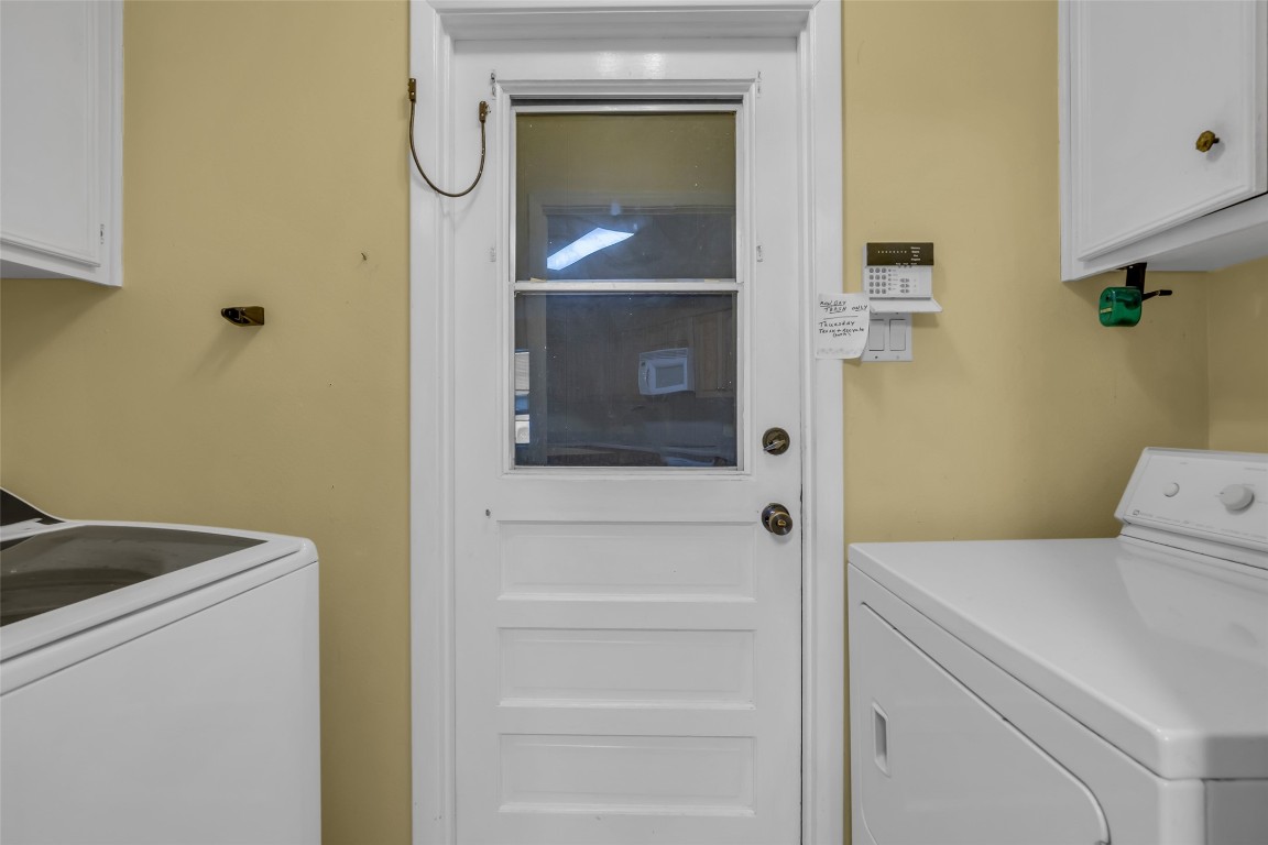 10002 Pinehurst Street Baytown, TX 77521 - Photo 12 of 17 a utility room with dryer and washer