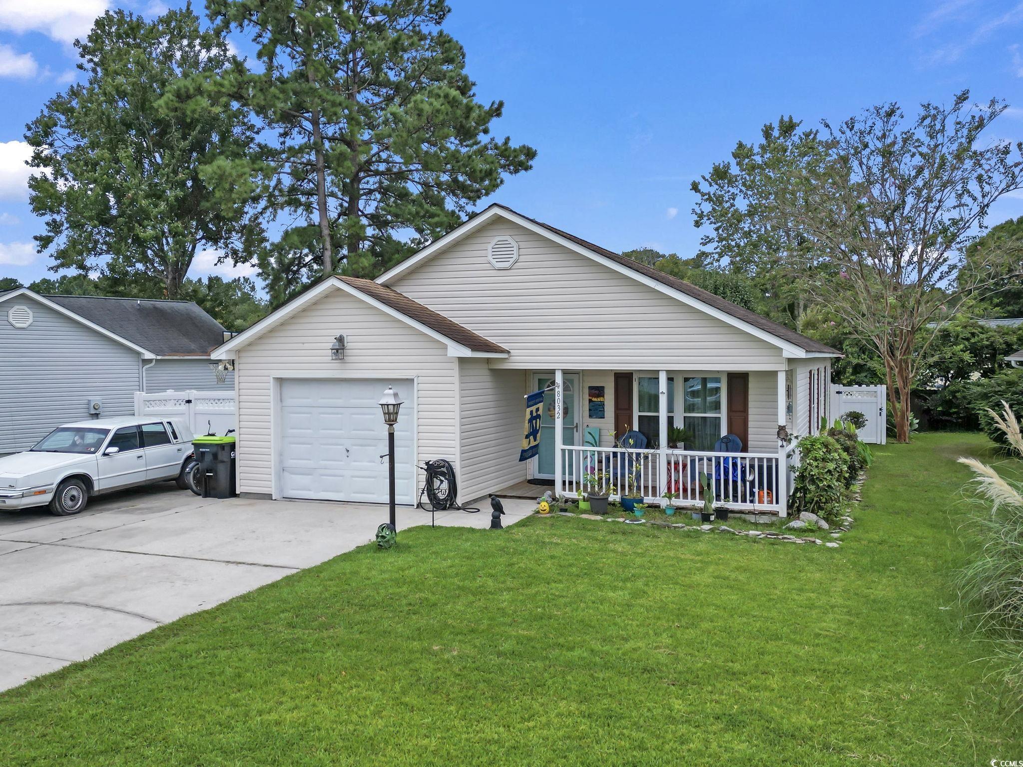 8032 Resin Road Murrells Inlet, SC 29576 - Photo 1 of 37 Ranch-style house featuring a garage, a porch, and