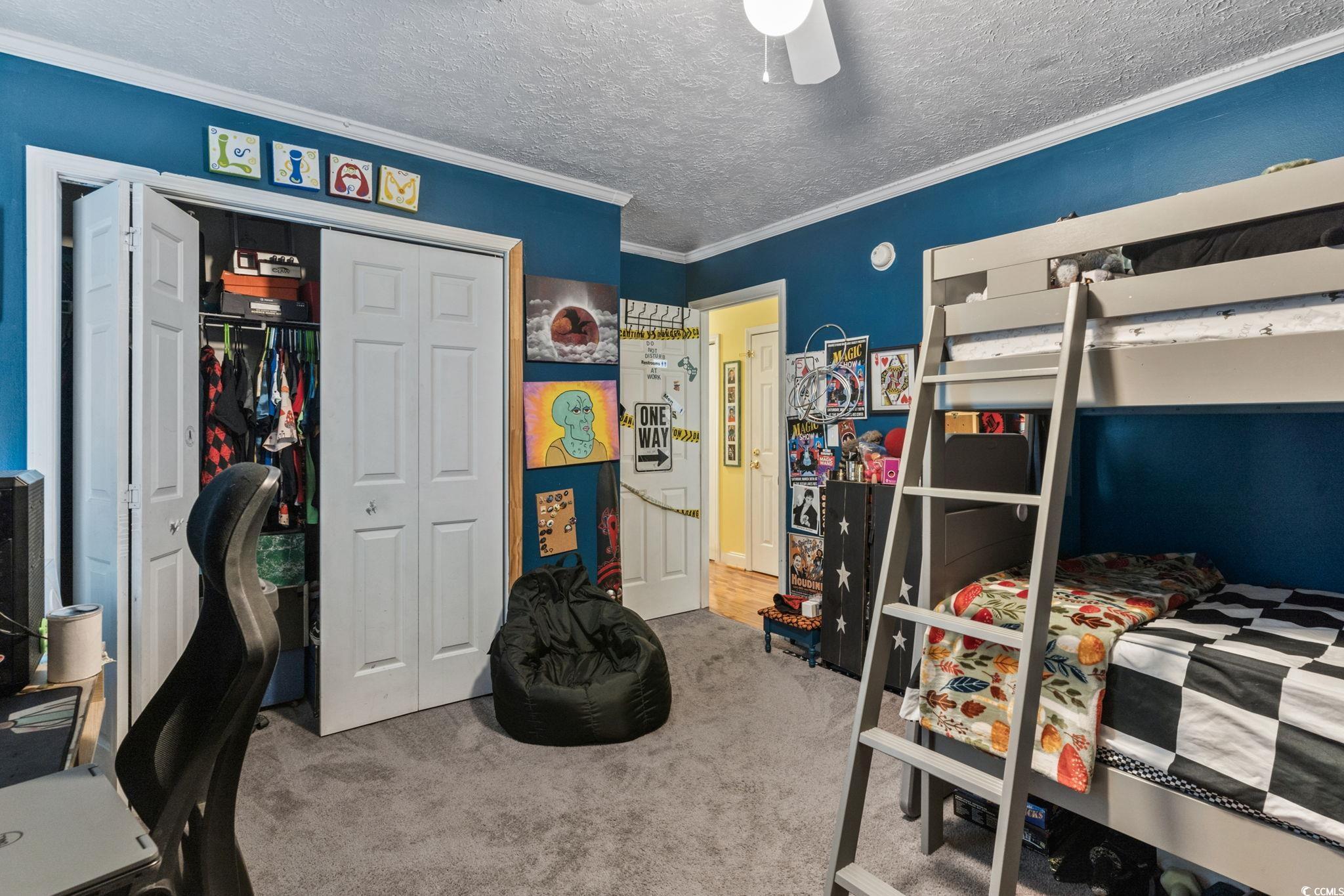 8032 Resin Road Murrells Inlet, SC 29576 - Photo 24 of 37 Bedroom featuring a textured ceiling, carpet floor