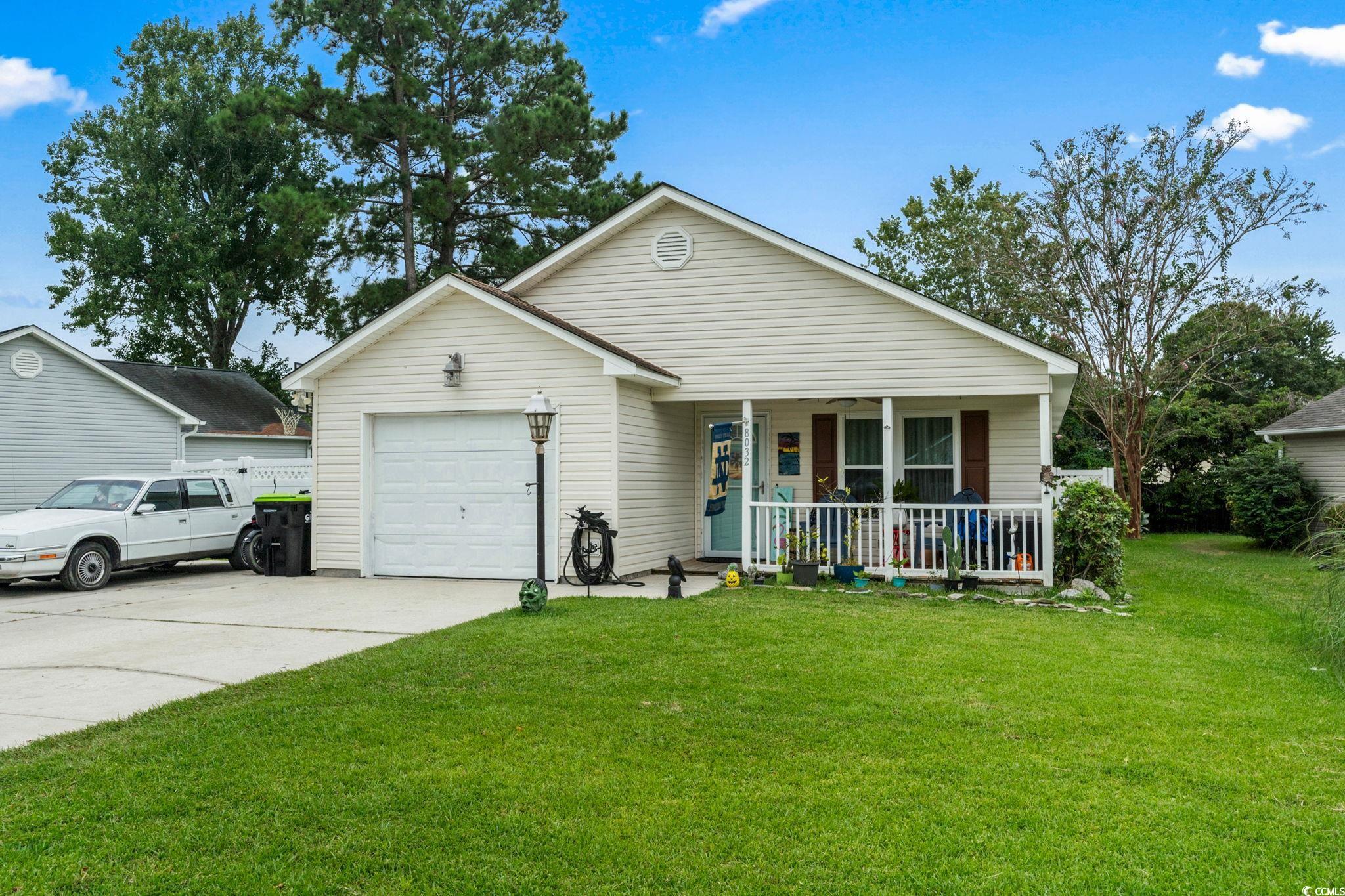 8032 Resin Road Murrells Inlet, SC 29576 - Photo 3 of 37 Single story home with a front lawn, a porch, and