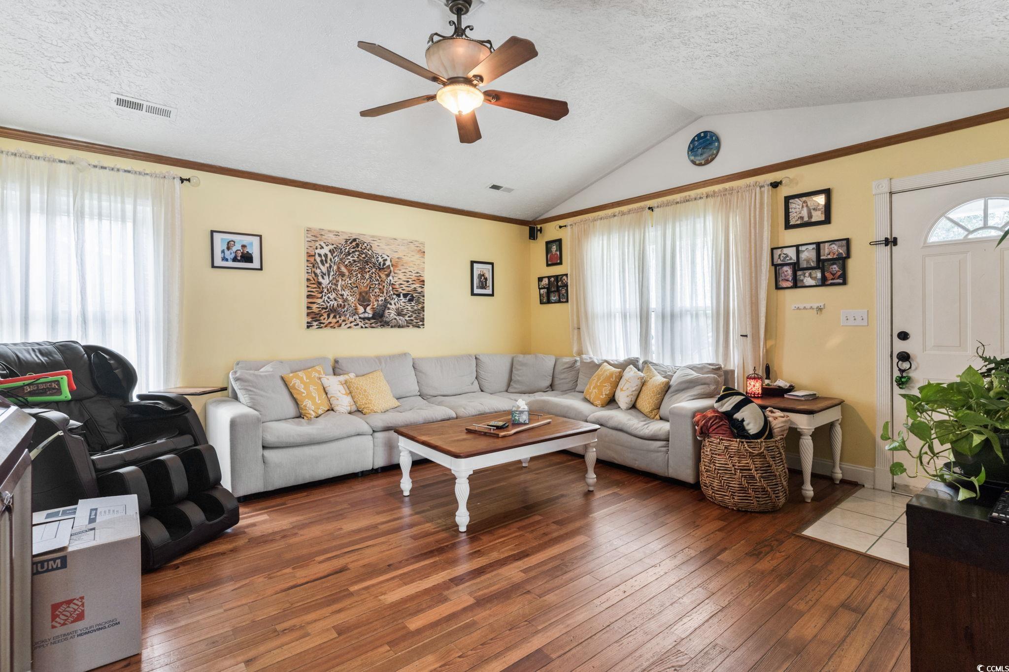 8032 Resin Road Murrells Inlet, SC 29576 - Photo 6 of 37 Living room featuring ceiling fan, lofted ceiling,