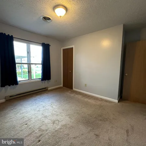 a view of a bathroom from a hallway