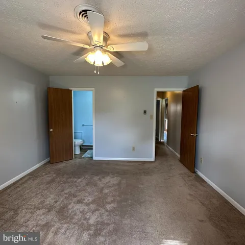 a view of kitchen and refrigerator