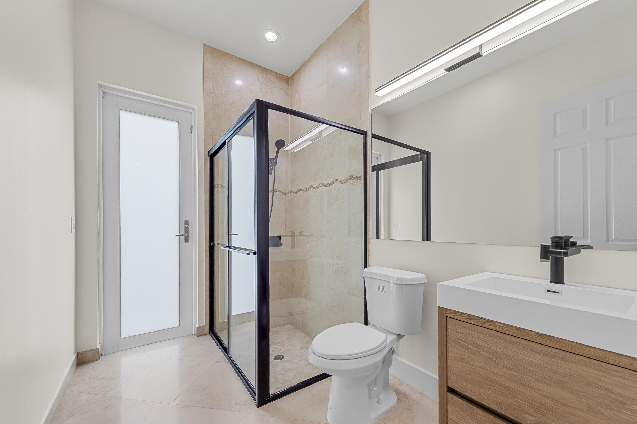 8680 Daystar Ridge Point Boynton Beach, FL 33473 - Photo 10 of 25 a bathroom with a sink toilet and shower