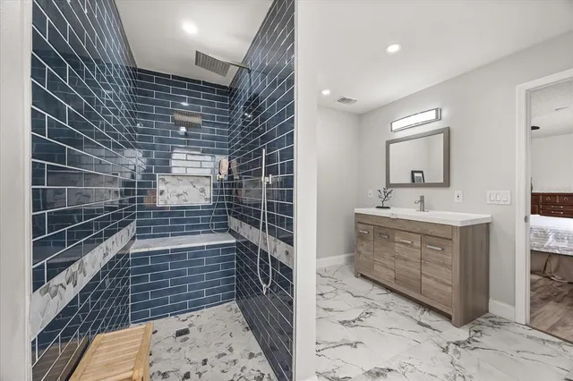 a bathroom with a sink and mirror