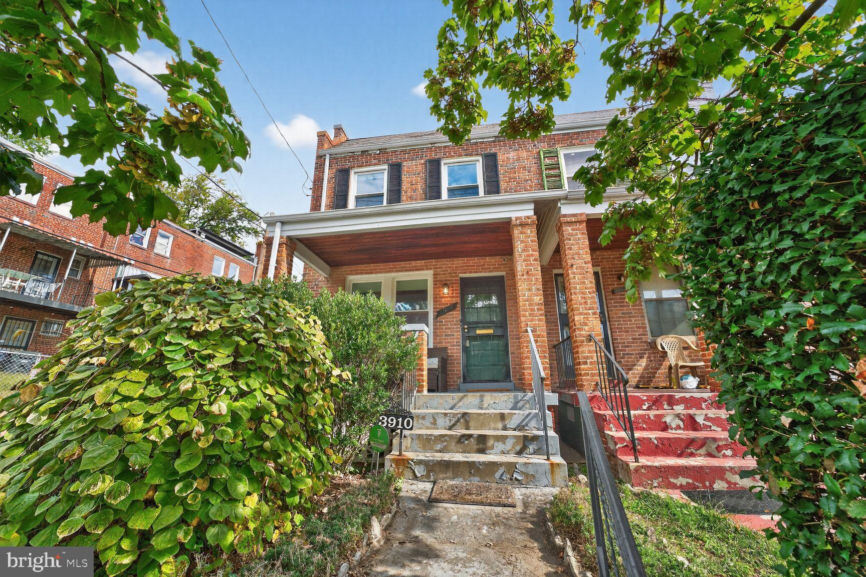 3910 R Street Southeast Washington, DC 20020 - Photo 1 of 24 Charming brick duplex with lush greenery.