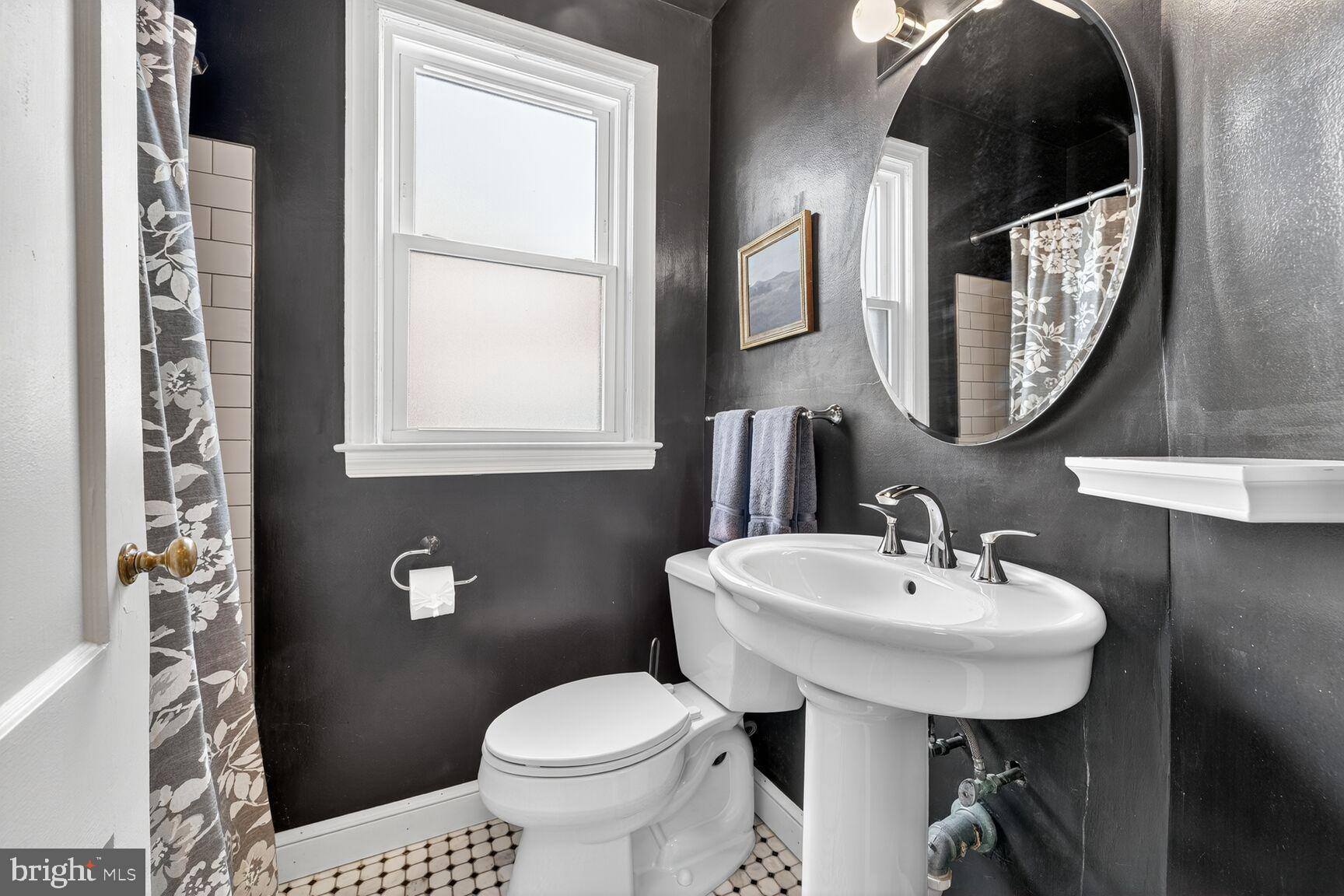 3910 R Street Southeast Washington, DC 20020 - Photo 14 of 24 Chic bathroom with modern accents.