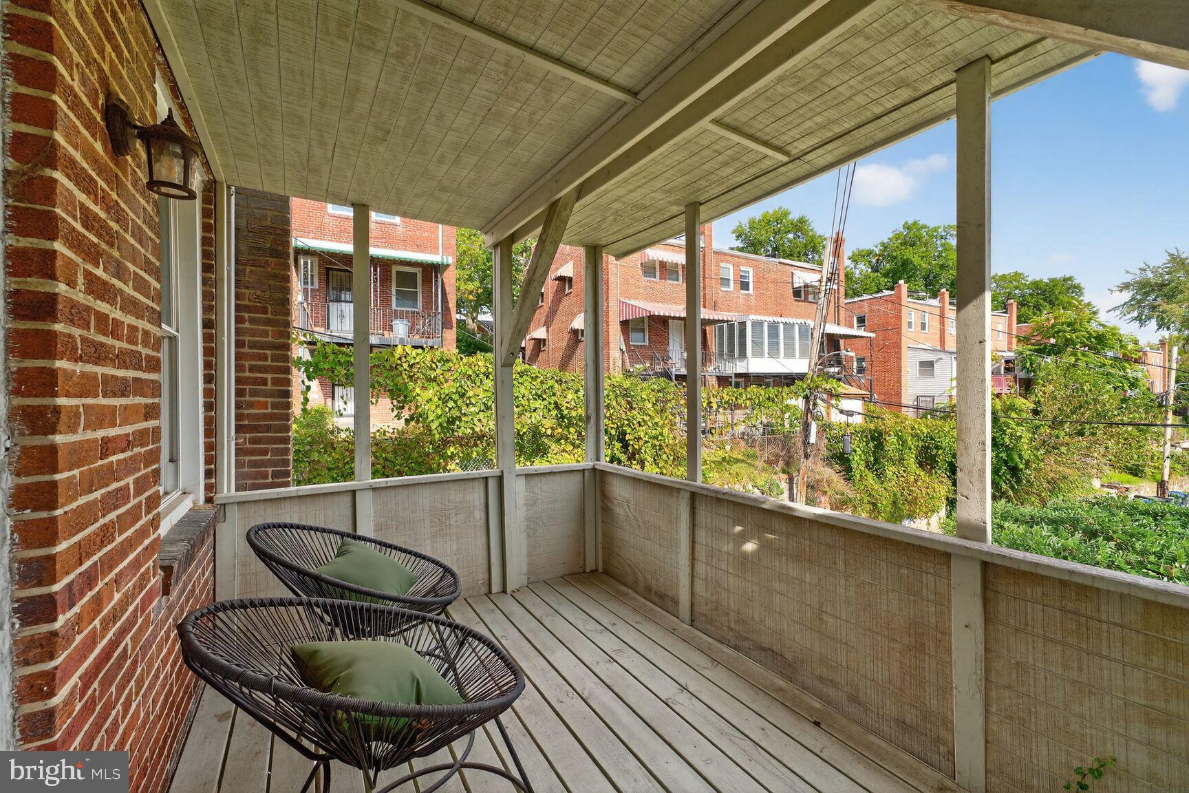 3910 R Street Southeast Washington, DC 20020 - Photo 2 of 24 Charming porch with scenic neighborhood views.