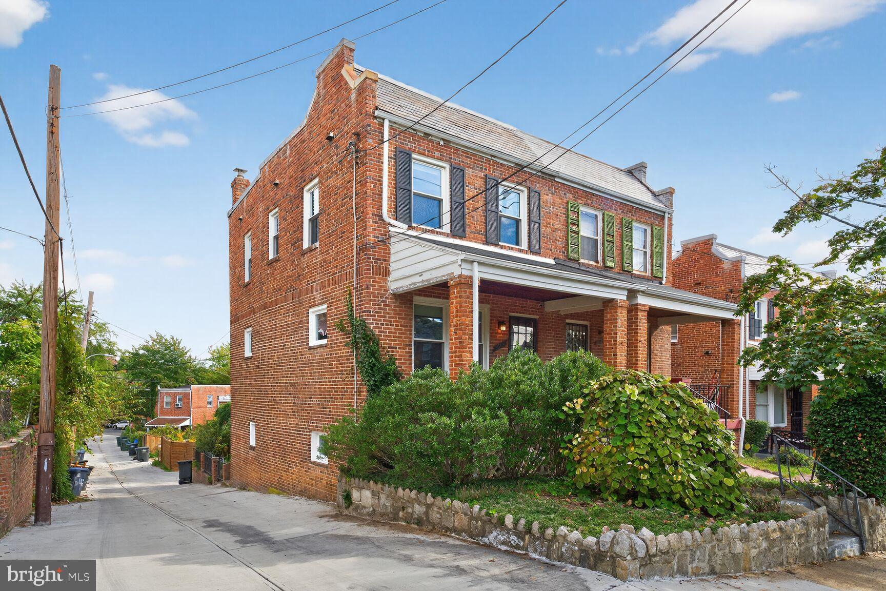 3910 R Street Southeast Washington, DC 20020 - Photo 23 of 24 Charming brick duplex with lush greenery.