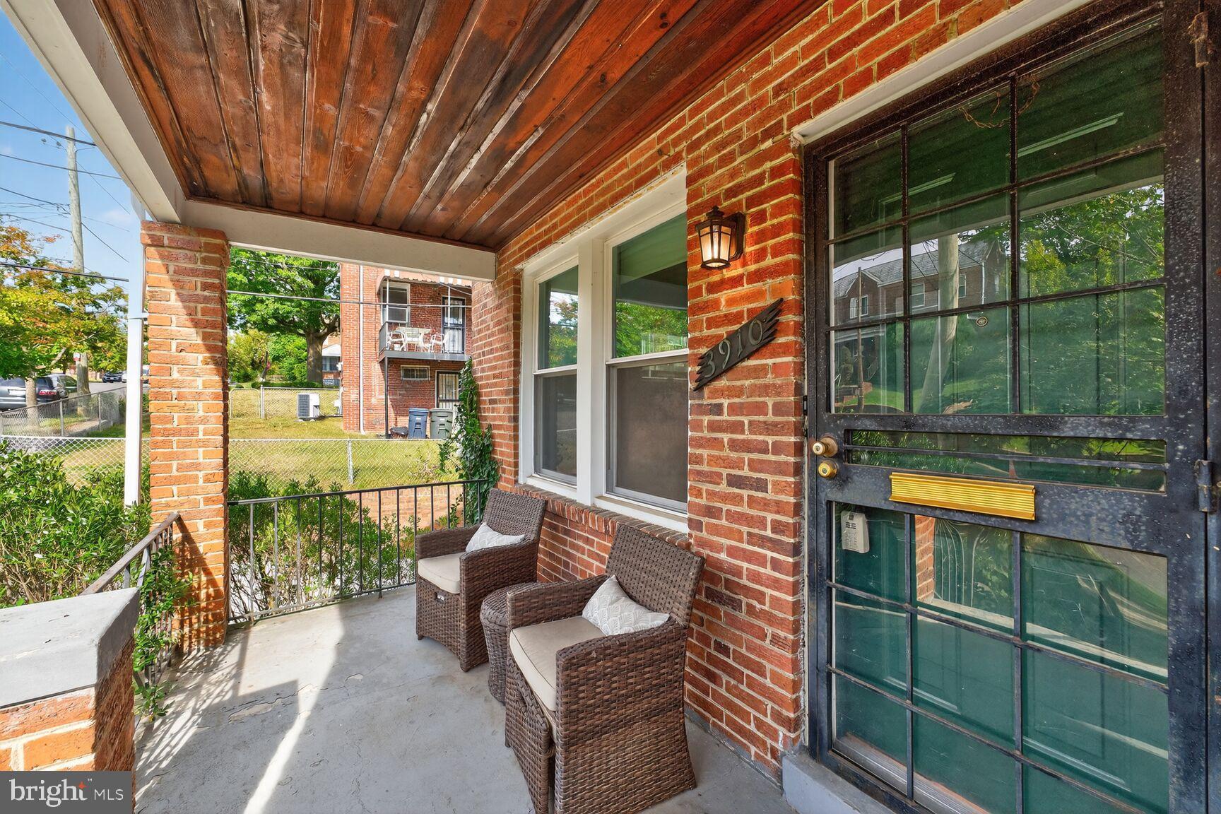 3910 R Street Southeast Washington, DC 20020 - Photo 3 of 24 Charming porch with inviting brick details.
