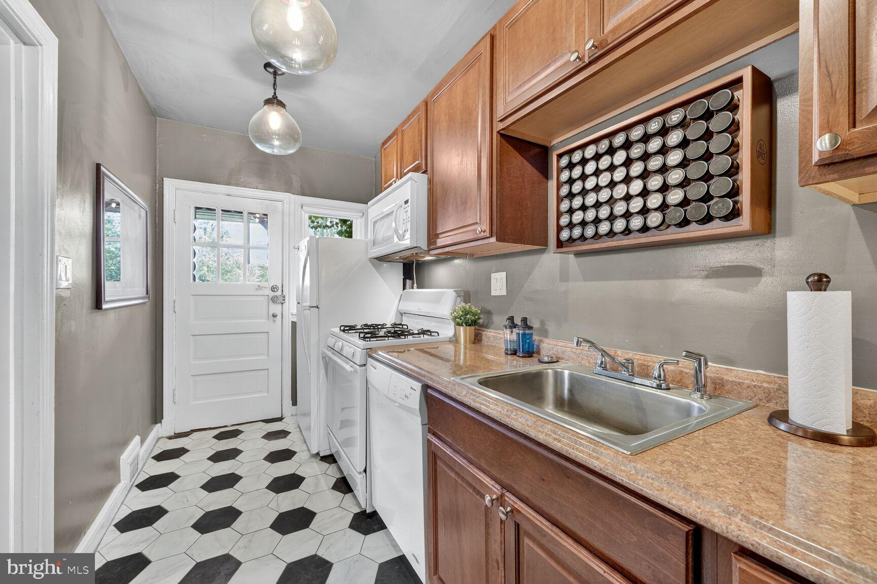 3910 R Street Southeast Washington, DC 20020 - Photo 9 of 24 Charming kitchen with modern touches.