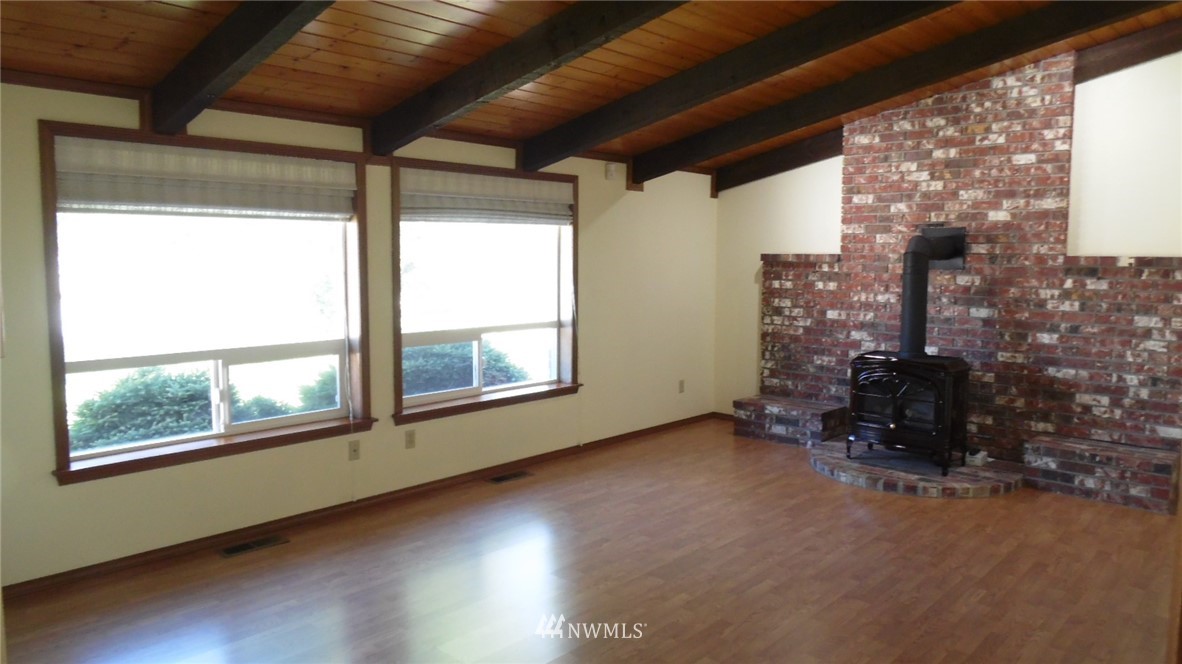 4538 180th Way Southwest Rochester, WA 98579 - Photo 2 of 25 a view of an empty room with a window