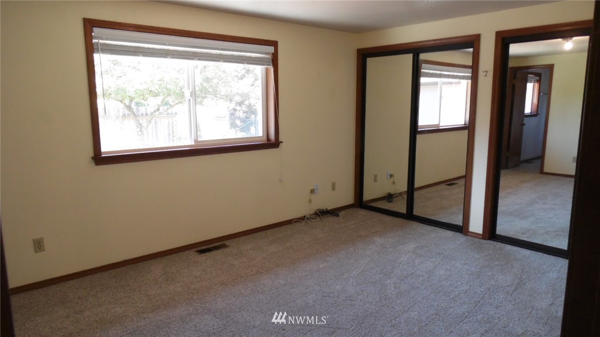 4538 180th Way Southwest Rochester, WA 98579 - Photo 13 of 25 an empty room with windows