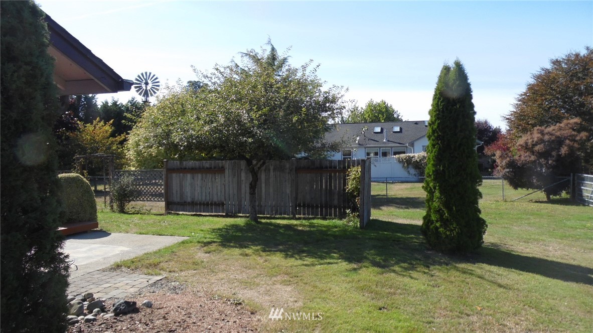 4538 180th Way Southwest Rochester, WA 98579 - Photo 19 of 25 a backyard of a house with lots of green space