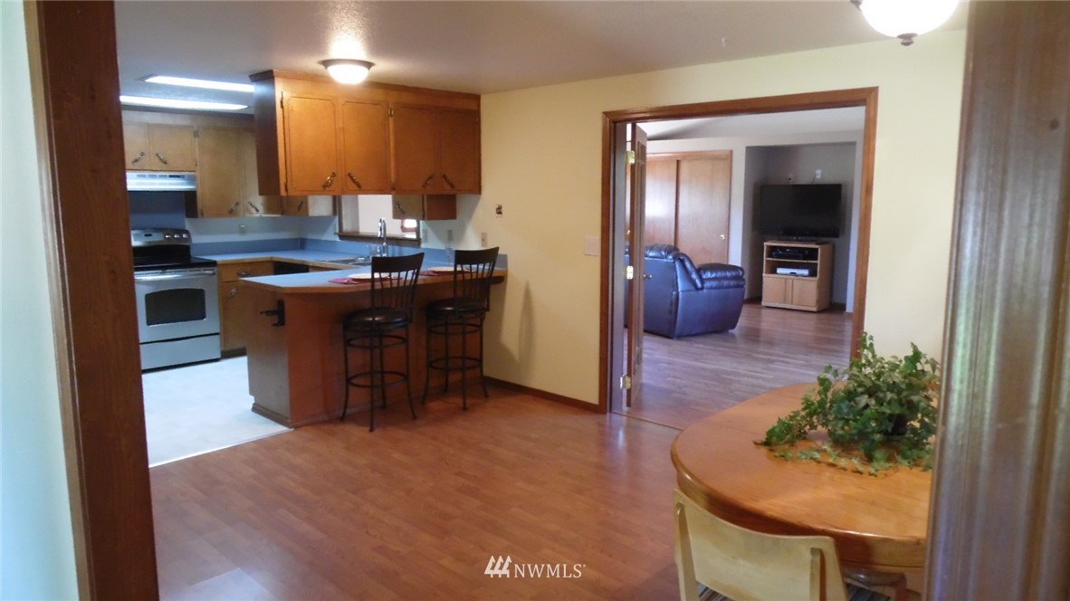4538 180th Way Southwest Rochester, WA 98579 - Photo 4 of 25 a kitchen with a sink and cabinets