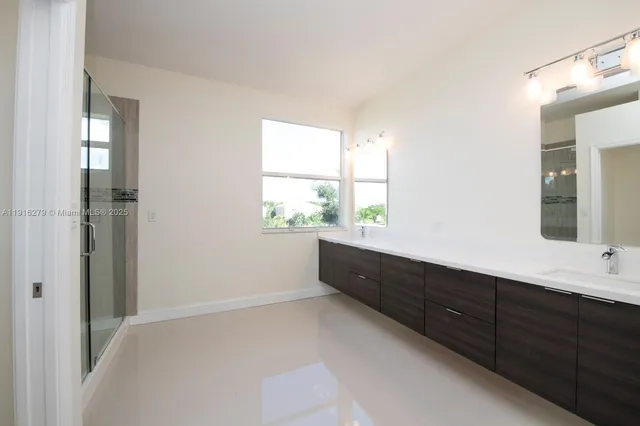 a bathroom with a shower and a tub