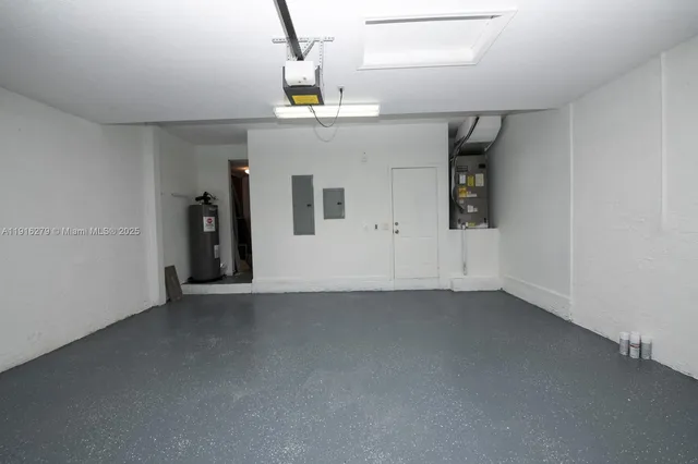 a view of a lake with a big yard and large trees