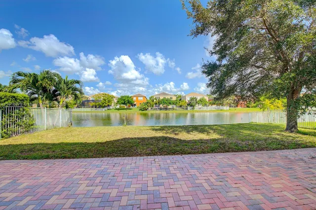 a view of a lake with houses in the back
