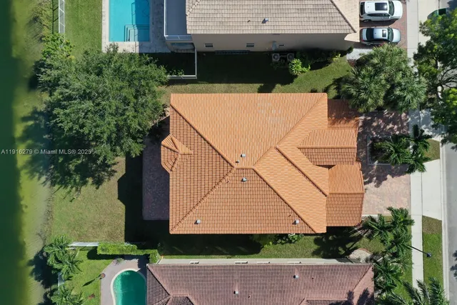 an aerial view of a house with a lake view