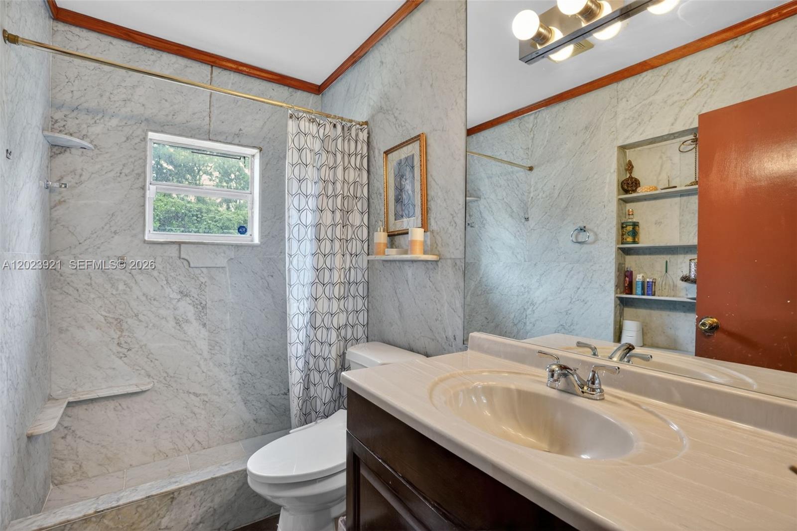 8461 Southwest 68th St Road Miami, FL 33143 - Photo 10 of 65 a bathroom with a sink toilet and shower