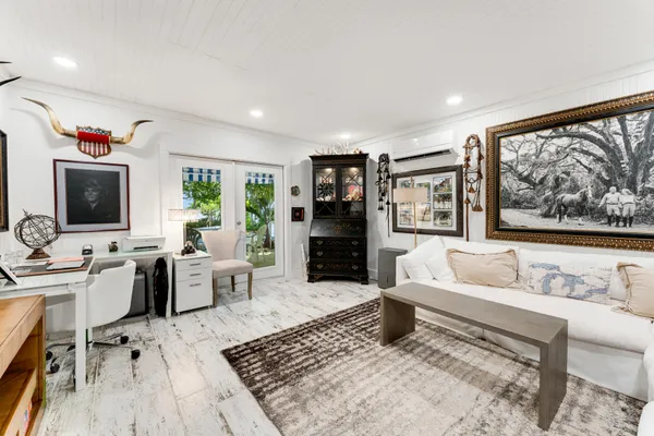 a bedroom with a large bed and a flat screen tv