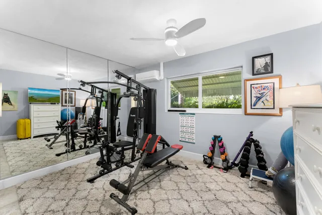 a bedroom with a large bed and a large window