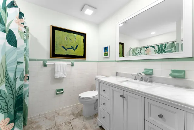 a bedroom with a bed and a large window with outer view